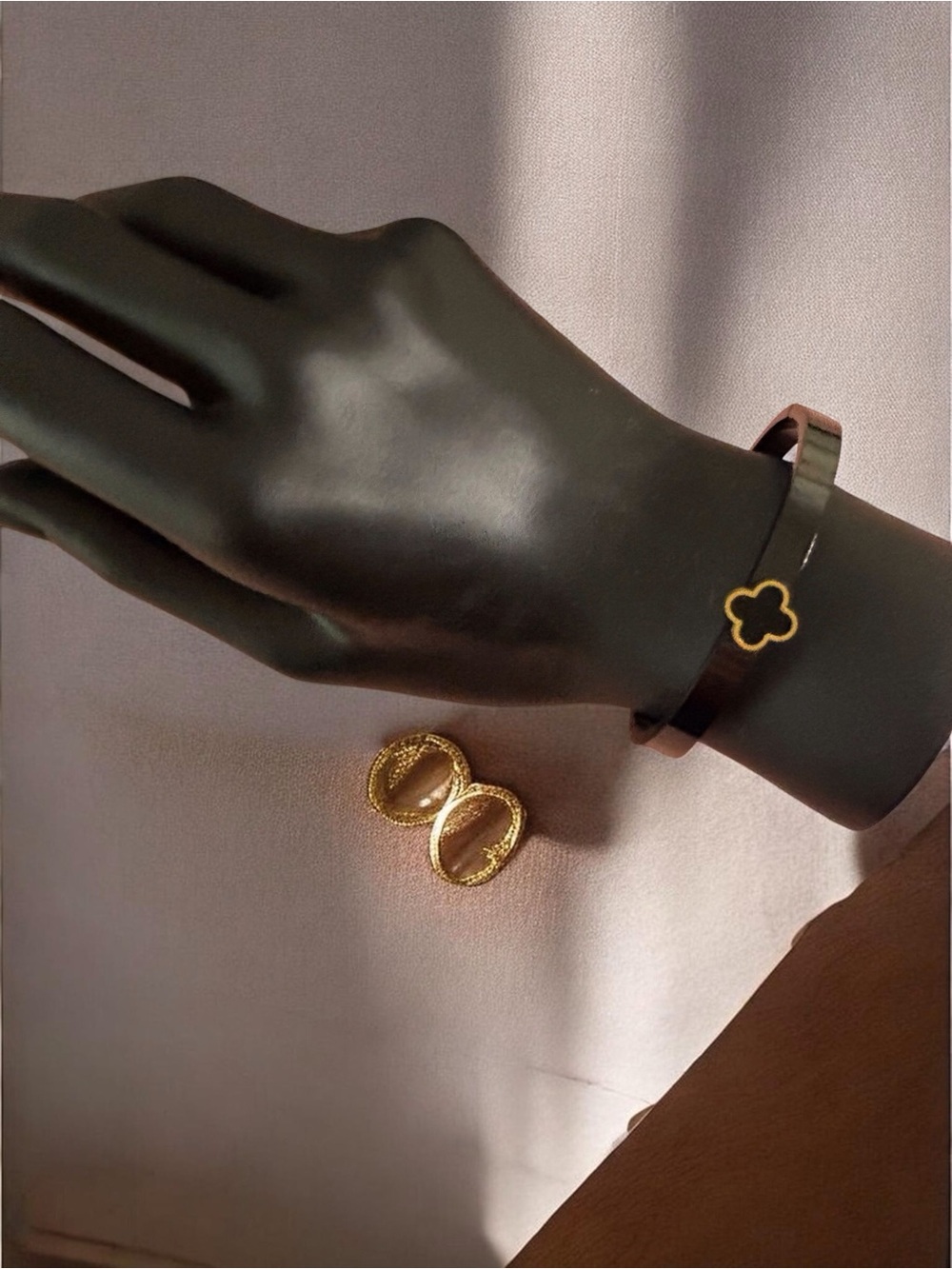 Gold Accent Black Bangle with Clover Motif